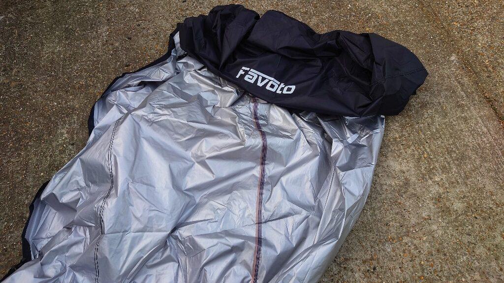 Internal side of Fasvoto motorcycle cover showing the inner silver lining.