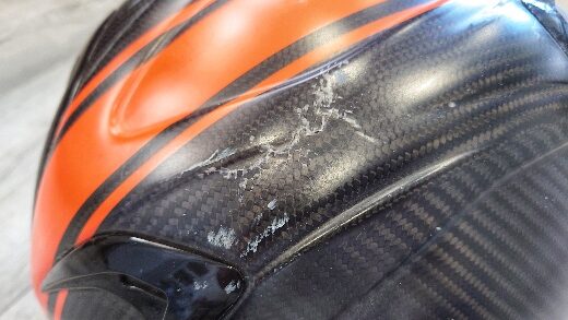 Close up of damaged motorcycle helmet