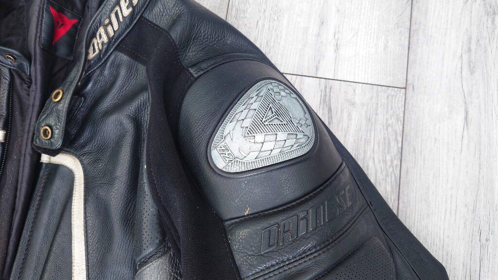 leather motorcycle jacket with added metal protectors on the shoulders
